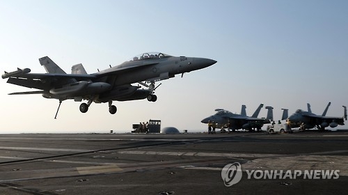 This photo taken on Oct. 14, 2016, shows a Super Hornet jet landing on the USS Ronald Reagan during a flight operation unveiled to South Korean reporters in the sea north of Jeju Island. (Yonhap)
