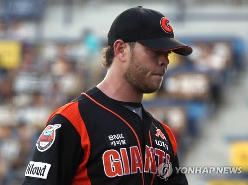 In this file photo taken on June 8, 2017, Nick Additon of the Lotte Giants leaves the mound after giving up five runs in the bottom of the first inning against the NC Dinos in their Korea Baseball Organization game at Masan Stadium in Changwon, South Gyeongsang Province. (Yonhap)