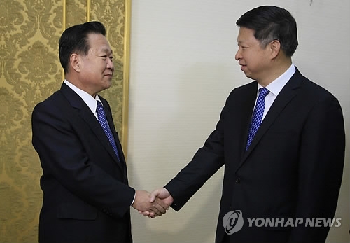 This photo, provided by The Associated Press on Nov. 17, 2017 shows Song Tao, a special envoy of Chinese President Xi Jinping (R) meets with Choe Ryong-hae, a senior North Korean party official, in Pyongyang. (Yonhap)