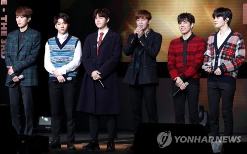 K-pop act INFINITE poses for photos during a media showcase for its third studio album "Top Seed." (Yonhap)