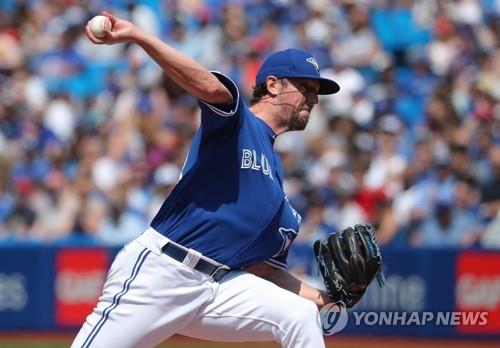 In this Getty Images file photo from May 24, 2018, Deck McGuire, then with the Toronto Blue Jays, delivers a pitch against the Los Angeles Angels in the top of the eighth inning of a Major League Baseball regular season game at Rogers Centre in Toronto. (Yonhap)