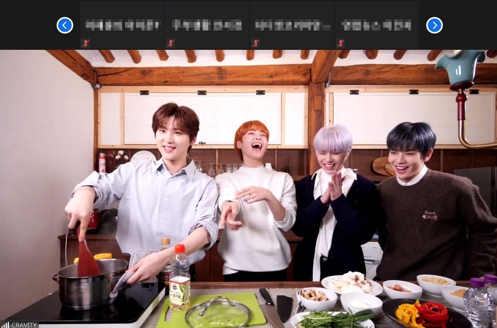 This photo, provided by Airbnb, shows K-pop boy band Cravity cooking a Korean dish during an online session hosted by the American accommodation rental company. (PHOTO NOT FOR SALE) (Yonhap)