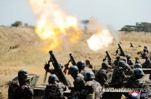 North Korean soldiers conduct a mortar firing drill being inspected by North Korean leader Kim Jong-un in this undated photo captured from the homepage of the Korean Central News Agency on April 10, 2020. (For Use Only in the Republic of Korea. No Redistribution) (Yonhap)