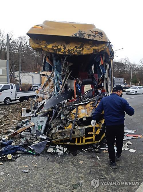 This photo provided by firefighting authorities shows the scene of a dump truck-bus collision on a motorway in Paju, some 30 kilometers north of Seoul, on March 31, 2022. (PHOTO NOT FOR SALE) (Yonhap)