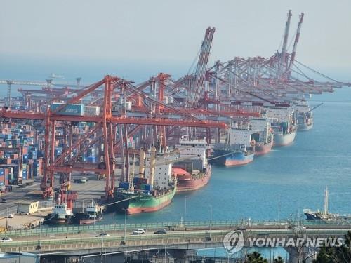 Shipping containers are stacked at a port in the southeastern city of Busan, in this file photo taken April 1, 2024. (Yonhap)
