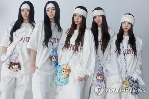 Members of K-pop girl group NewJeans are seen in this undated file photo provided by ADOR. (PHOTO NOT FOR SALE) (Yonhap)
