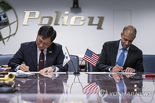 Cho Chang-rae (L), head of the South Korean defense ministry's policy bureau, and Vipin Narang, U.S. principal deputy assistant secretary of defense for space policy, sign the Framework on the South Korea-U.S. Nuclear Consultative Group (NCG) at the Pentagon in Arlington County, Virginia, on Feb. 12, 2024, in this photo provided by Seoul's defense ministry. (PHOTO NOT FOR SALE) (Yonhap)