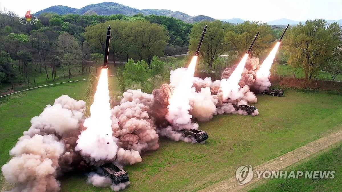 This file photo, captured from video footage aired on North Korea's official Korean Central Television on April 23, 2024, shows the North staging a firing drill involving 600 mm multiple rocket launchers the previous day, guided by North Korean leader Kim Jong-un. (For Use Only in the Republic of Korea. No Redistribution) (Yonhap)