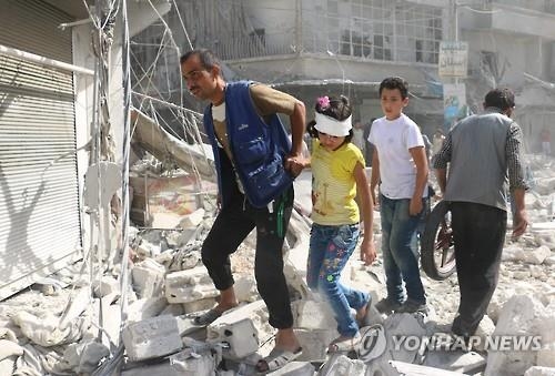 공습으로 파괴된 알레포 도시 [AFP=연합뉴스 자료사진]