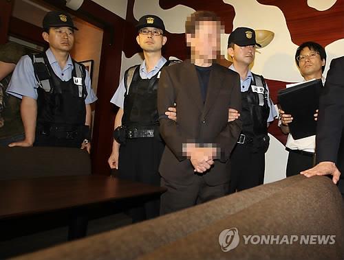 2011년 7월 함바비리 사건에 연루돼 구속기소된 유상봉 씨의 현장검증 장면