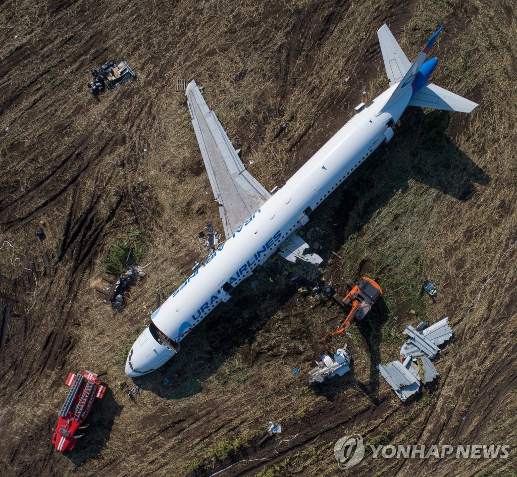 Dismantling Airbus A321 jet at crash landing site near Zhukovsky Airport