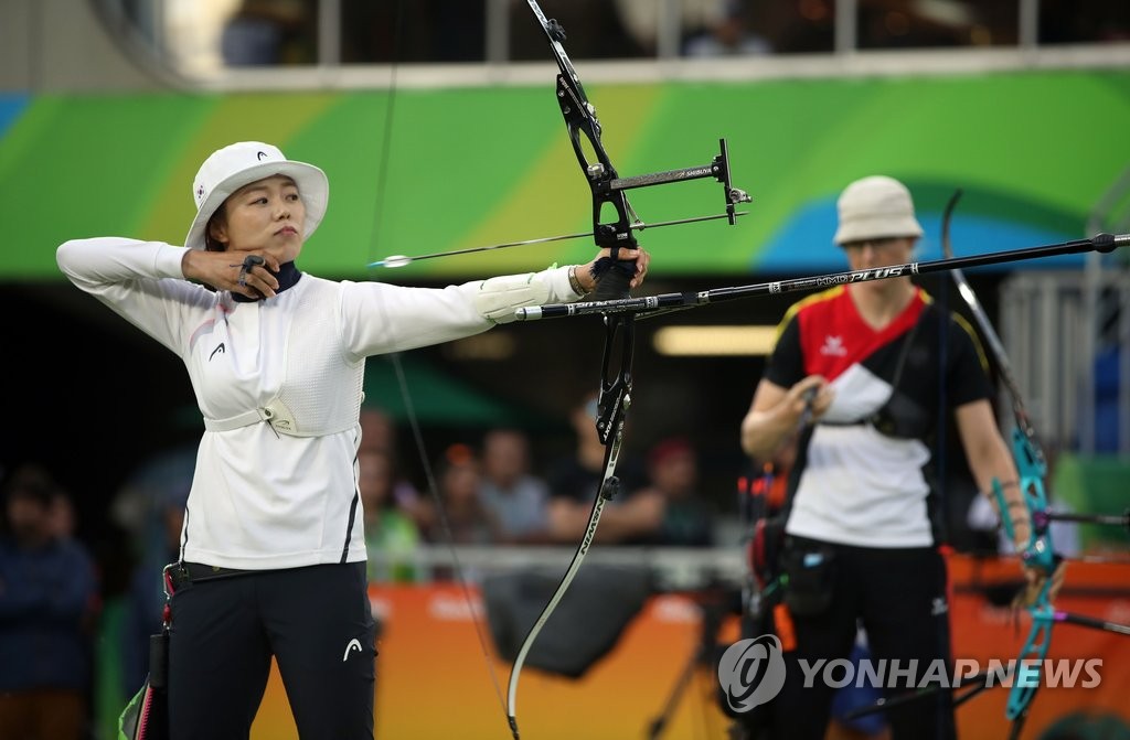 <올림픽> 날아가는 금빛 화살