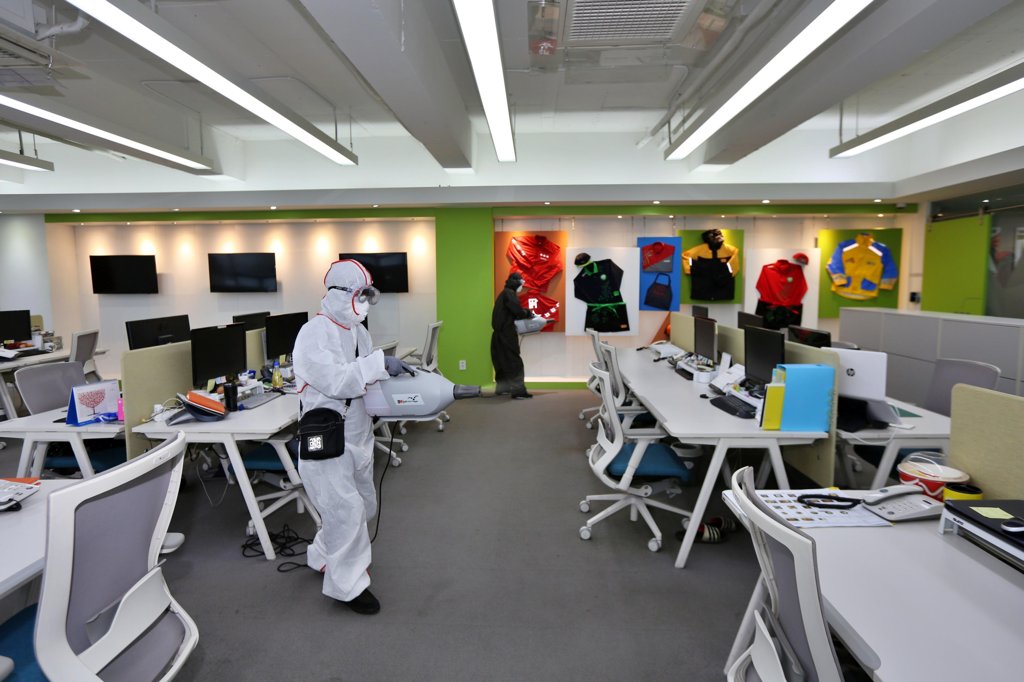 This photo, provided by food company BBQ, shows its office being disinfected after employees were advised to work from home. (PHOTO NOT FOR SALE) (Yonhap)