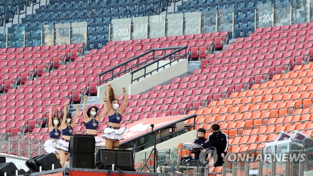 Cheerleaders for the Korea Baseball Organization club Doosan Bears perform during the Bears' home game against the SK Wyverns at Jamsil Stadium in Seoul on May 27, 2020. (Yonhap)