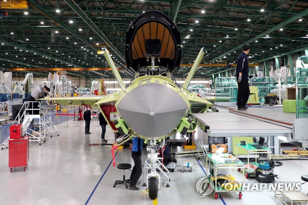 Workers of Korea Aerospace Industries (KAI) assemble a prototype of South Korea's first indigenous fighter jet KF-X at its plant in the southeastern city of Sacheon on Feb. 24, 2021, in this photo provided by the Kookbang Ilbo newspaper. (PHOTO NOT FOR SALE) (Yonhap)