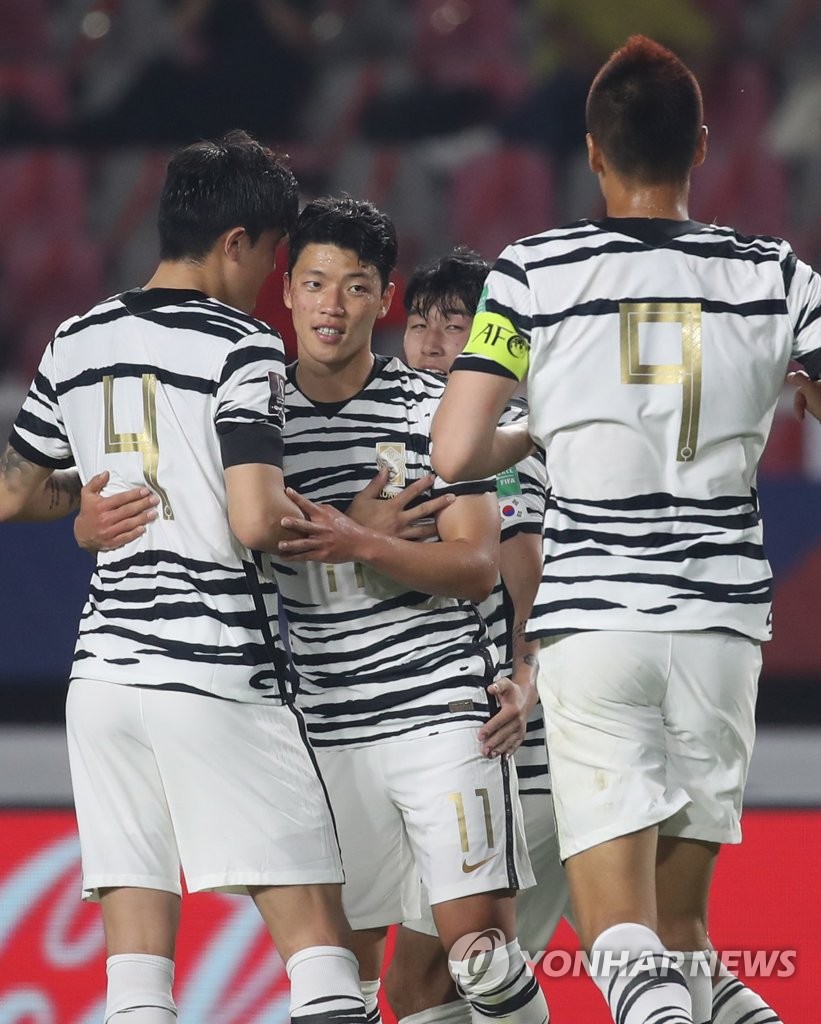 Hwang Hee-chan of South Korea (C) celebrates his goal against Sri Lanka with teammates during the teams' Group H match in the second round of the Asian qualification for the 2022 FIFA World Cup at Goyang Stadium in Goyang, Gyeonggi Province, on June 9, 2021. (Yonhap)