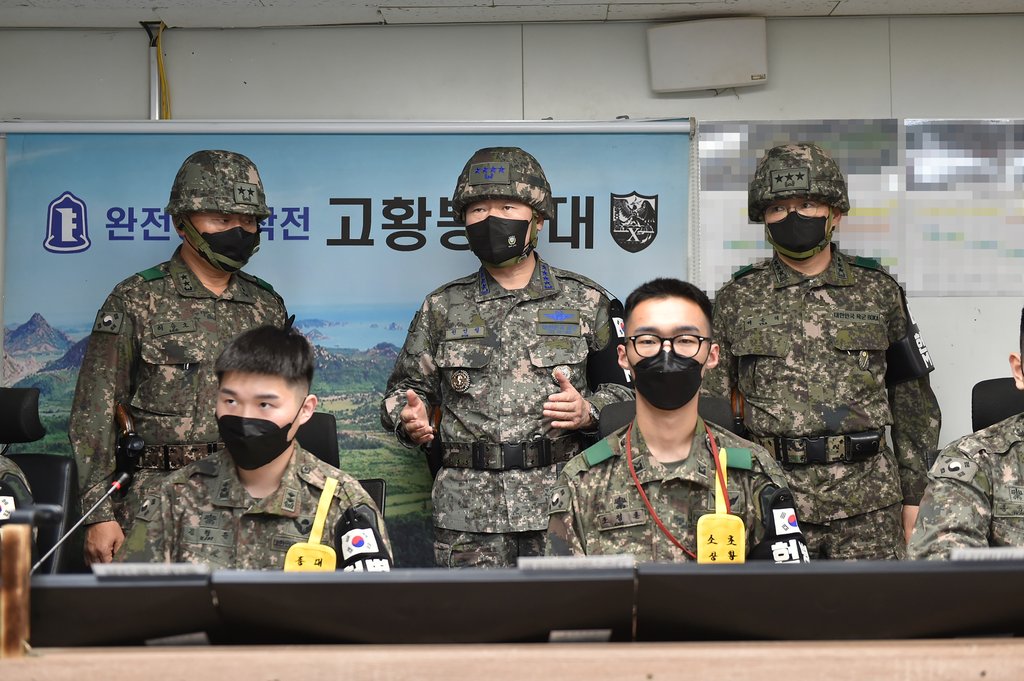 Joint Chiefs of Staff (JCS) Chairman Gen. Won In-choul (2nd row, C) inspects a front-line unit of the Army's 22nd Division in charge of the eastern border area to check its readiness, in Gangwon Province, northeast of Seoul, on May 17, 2022, in this photo provided by the JCS. (PHOTO NOT FOR SALE) (Yonhap) 