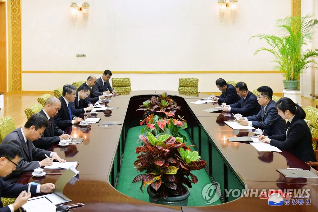 This photo, carried by North Korea's official Korean Central News Agency on April 8, 2023, shows China's new ambassador to North Korea, Wang Yajun delivering a message from Chinese President Xi Jinping for North Korean leader Kim Jong-un to Kim Song-nam (2nd from R), international department director of the North's ruling party the previous day. (For Use Only in the Republic of Korea. No Redistribution) (Yonhap)