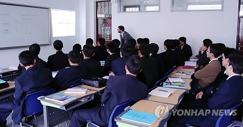This 2011 file photo shows a foreign professor teaching a group of students during a class at the Pyongyang University of Science and Technology. (Yonhap)