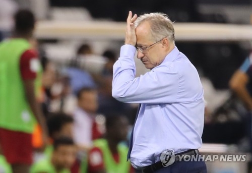 Uli Stielike, former head coach of the South Korean men's football team, leaves Jassim Bin Hamad Stadium in Doha on June 13, 2017, after his team's 3-2 loss to Qatar in a World Cup qualifying match. (Yonhap)