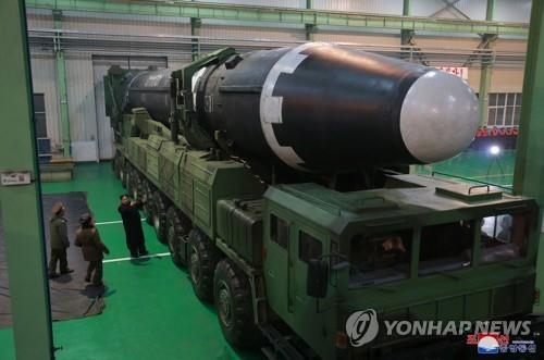 North Korea's new Hwasong-15 ICBM lies mounted on a mobile launcher in this photo released by its state media. (For Use Only in the Republic of Korea. No Redistribution) (Yonhap)