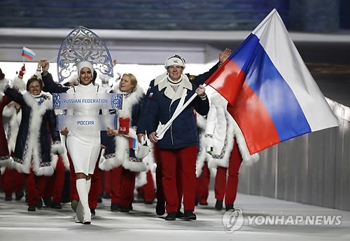 In this Associated Press photo taken Feb. 7, 2014, members of the Russian delegation enter Fisht Olympic Stadium for the opening ceremony of the 2014 Sochi Winter Olympics. The International Olympic Committee banned Russia from the 2018 PyeongChang Winter Olympics over state-sponsored doping on Dec. 5, 2017, allowing only a select few athletes to compete as neutrals if they meet strict conditions. (Yonhap)