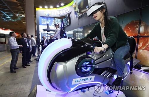 This file photo shows a person trying out a VR game system. (Yonhap)