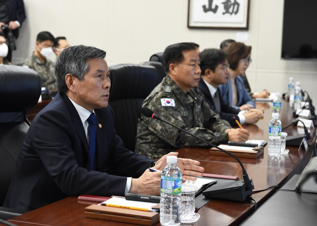 Defense Minister Jeong Kyeong-doo (L) presides over a video conference with Navy commanders in the Navy Submarine Force Command in the southeastern city of Changwon, South Gyeongsang Province, on March 11, 2020, in this photo provided by his office. (PHOTO NOT FOR SALE) (Yonhap)