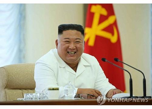 North Korean leader Kim Jong-un smiles during a politburo meeting of the ruling Workers' Party in this photo released by the North's official Korean Central News Agency on June 8, 2020. (For Use Only in the Republic of Korea. No Redistribution) (Yonhap)
