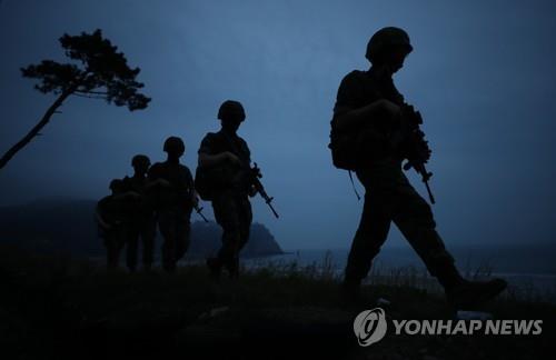 South Korean marines walk in single file as they patrol Yeonpyeong Island in the Yellow Sea on June 17, 2020. South Korea's military is on high alert against any provocation by North Korea after inter-Korean tensions spiked following the demolition of a joint liaison office on June 16. (Yonhap)