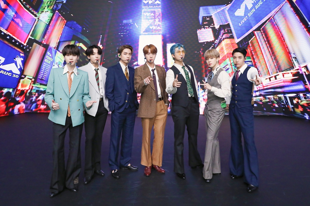 This photo provided by Big Hit Entertainment on Aug. 31, 2020, shows K-pop band BTS posing for photos ahead of a recent shooting of a performance for "Dynamite" aired on the 2020 MTV Video Music Awards. (PHOTO NOT FOR SALE) (Yonhap)