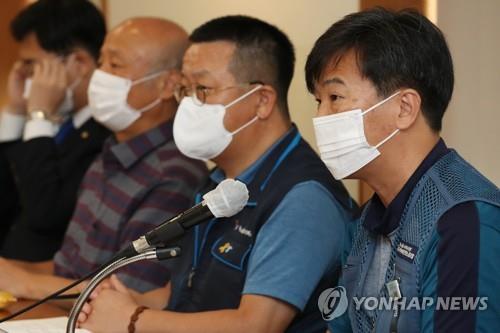 Parcel delivery workers and civic activists speak during a forum on the overwork of courier workers in Seoul on Sept. 10, 2020. (Yonhap)