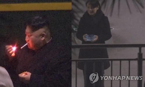 This composite photo provided by Japan's TBS shows North Korean leader Kim Jong-un (L) smoking and his sister Kim Yo-jong (R) standing near him with an ashtray in her hands, during a break on their train trip to Hanoi, Vietnam, on Feb. 26, 2019, to attend a summit meeting with U.S. President Donald Trump. (PHOTO NOT FOR SALE) (Yonhap)