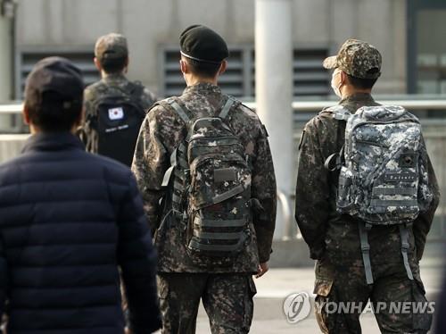 In this file photo taken Nov. 1, 2021, soldiers walk outside Seoul Station on the first day of the "living with COVID-19" measures that South Korea adopted to phase out coronavirus restrictions and reopen the economy amid rising vaccination levels. (Yonhap)