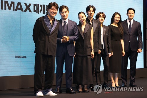 The main cast of "Emergency Declaration," a Korean disaster flick set to open in August, pose for the camera during a press conference to promote the film project at a Seoul hotel on June 20, 2022. (Yonhap)