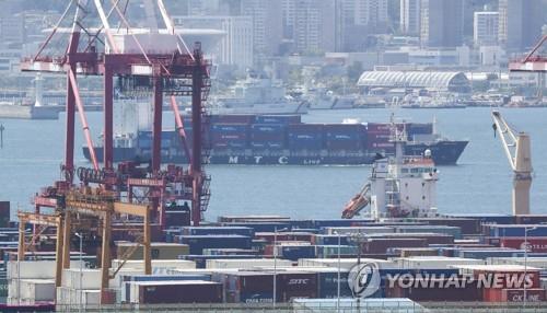 This file photo, taken July 1, 2022, shows stacks of containers at a port in South Korea's southeastern city of Busan. (Yonhap)