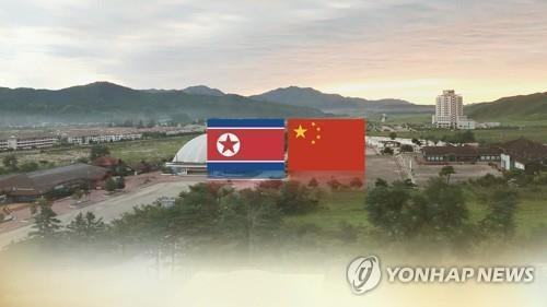 This undated composite image, provided by Yonhap News TV, shows the national flags of North Korea (L) and China. (PHOTO NOT FOR SALE) (Yonhap)