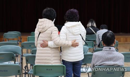 People wait at a community service center near the site of the Itaewon stampede on Oct. 30, 2022, after making reports for missing persons. (Yonhap)