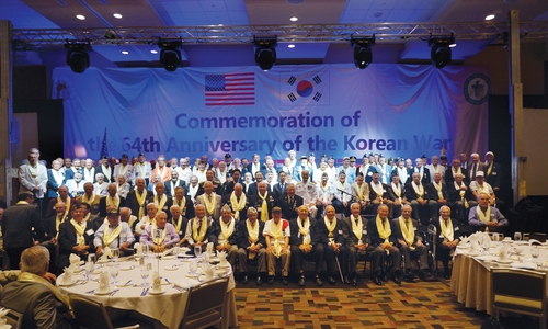 Participants pose during an event held in Chicago, the United States, on June 15, 2014, to commemorate the 64th Korean War anniversary in this file photo provided by the Saeeden Church in Yongin, 40 kilometers south of Seoul. (PHOTO NOT FOR SALE) (Yonhap)