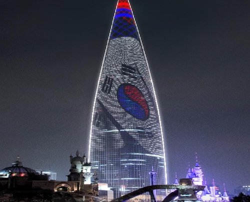 An image of South Korea's flag is displayed across Lotte World Tower in southern Seoul to commemorate the 70th anniversary of the signing of the armistice that ended the 1950-53 Korean War in this photo provided by the veterans ministry on July 21, 2023. (PHOTO NOT FOR SALE) (Yonhap)