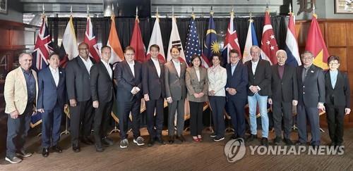 This file photo, provided by South Korea's industry ministry, shows ministers and representatives of member nations of the Indo-Pacific Economic Framework posing for a photo after a ministerial meeting in Detroit on May 27, 2023. (PHOTO NOT FOR SALE) (Yonhap)