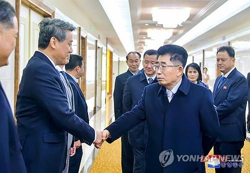 This image, captured from the website of North Korea's official Korean Central News Agency on March 22, 2024, shows Kim Song-nam (R), head of the country's ruling party delegation, before he embarked on a three-nation tour to China, Vietnam and Laos the previous day. (For Use Only in the Republic of Korea. No Redistribution) (Yonhap)