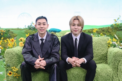 BTS' Jimin (R) and rapper Loco are seen in this photo provided by BigHit Music. (PHOTO NOT FOR SALE) (Yonhap) 