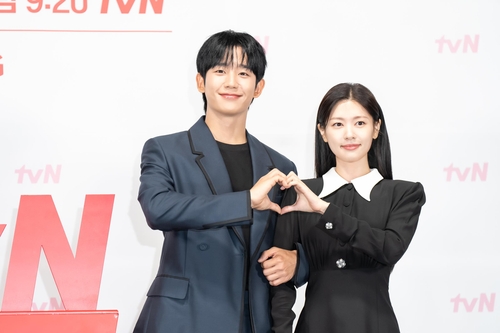 Actors Jung Hae-in and Jung So-min pose for photos during a press event for tvN's upcoming romantic comedy, "Love Next Door," in Seoul on Aug. 14, 2024, in this photo provided by the cable network. (PHOTO NOT FOR SALE) (Yonhap)