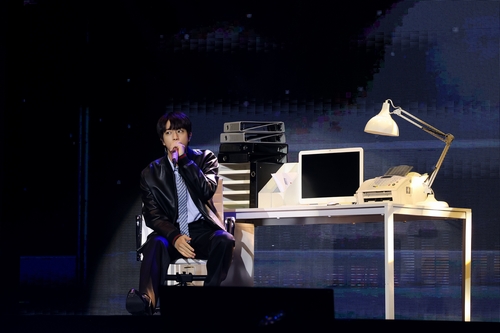 BTS' Jin performs on stage during a fan showcase for his first solo album, "Happy," in this photo provided by BigHit Music. (PHOTO NOT FOR SALE) (Yonhap)