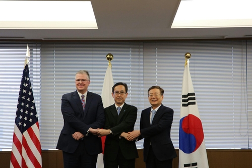 (From R to L) South Korea's Vice Foreign Minister for Strategy and Intelligence Cho Koo-rae; Hiroyuki Namazu, director general for Asian and Oceanian affairs at Japan's foreign ministry; and Assistant Secretary of State for East Asian and Pacific Affairs Daniel Kritenbrink, pose for a photo ahead of their talks in Tokyo on Dec. 9, 2024, as provided by South Korea's foreign ministry. (PHOTO NOT FOR SALE) (Yonhap)