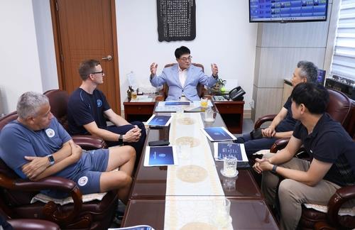 This photo provided by Samcheok on July 24, 2025, shows the city's officials in talks with representatives from the Premier League club Manchester City. (PHOTO NOT FOR SALE) (Yonhap)
