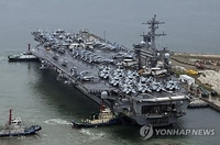 2 Chinese men indicted for allegedly filming U.S. aircraft carrier at naval base in S. Korea