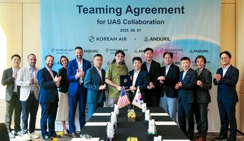 This photo, provided by Korean Air Co., shows representatives of the South Korean company and U.S. defense technology company Anduril Industries Inc. attending a partnership agreement signing ceremony at a hotel in Seoul on Aug. 7, 2025. (PHOTO NOT FOR SALE) (Yonhap)
