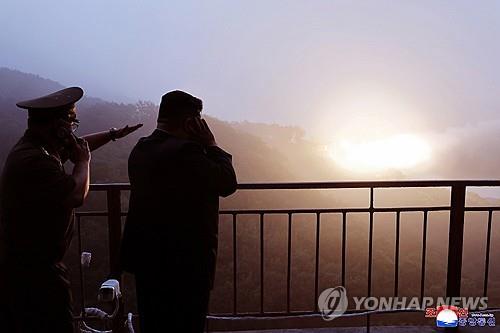 (LEAD) N. Korea's Kim oversees test of high-thrust, solid-fuel carbon fiber missile engine: KCNA